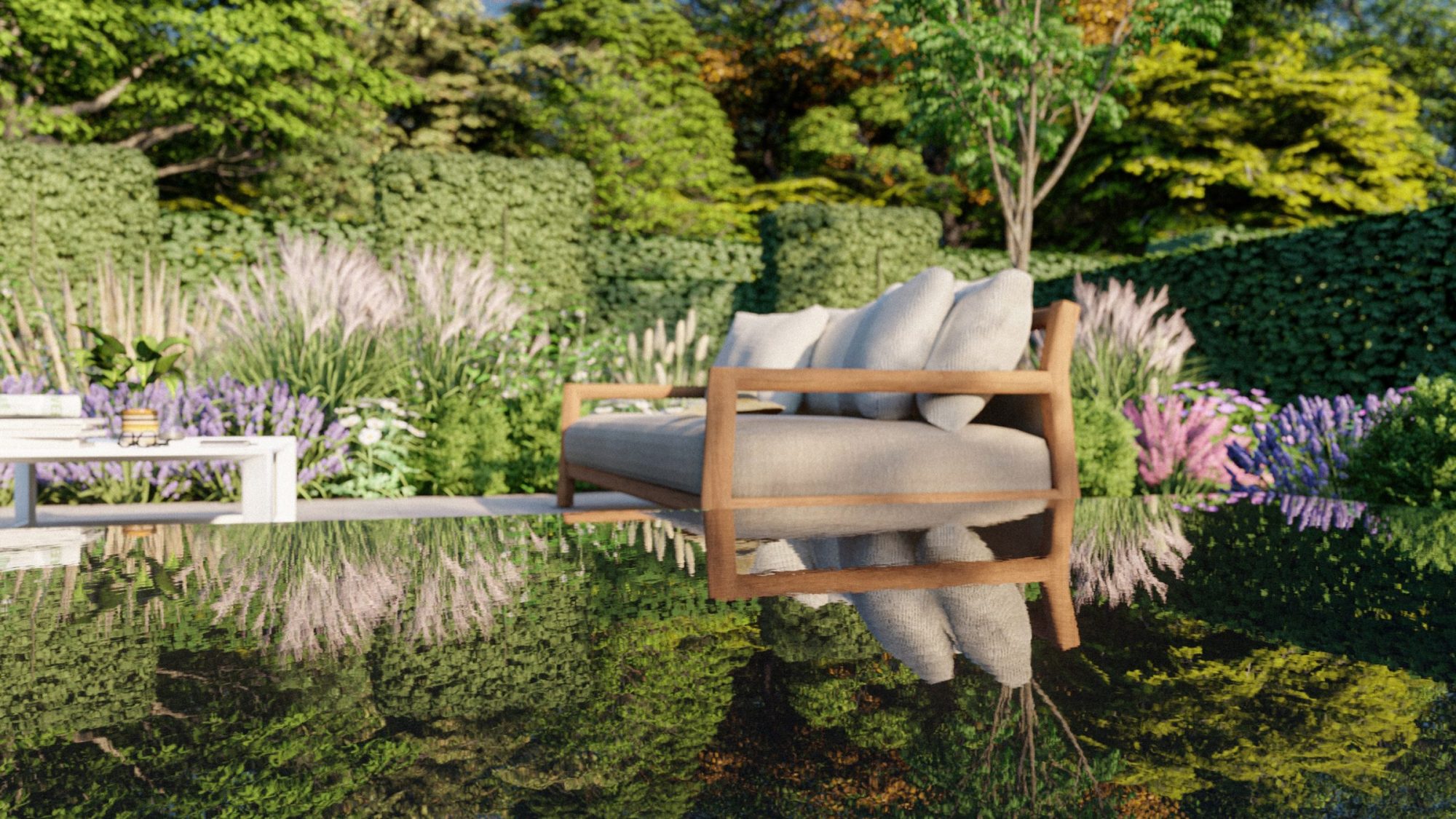 Close view across a reflective water feature towards timber seating surrounded by ornamental grasses and purple planting